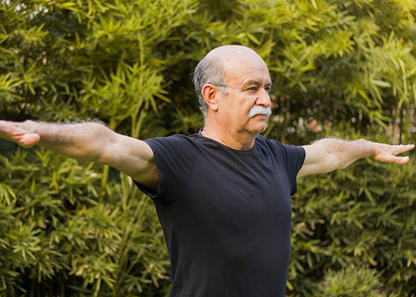 medium-shot-man-stretching-his-arms2