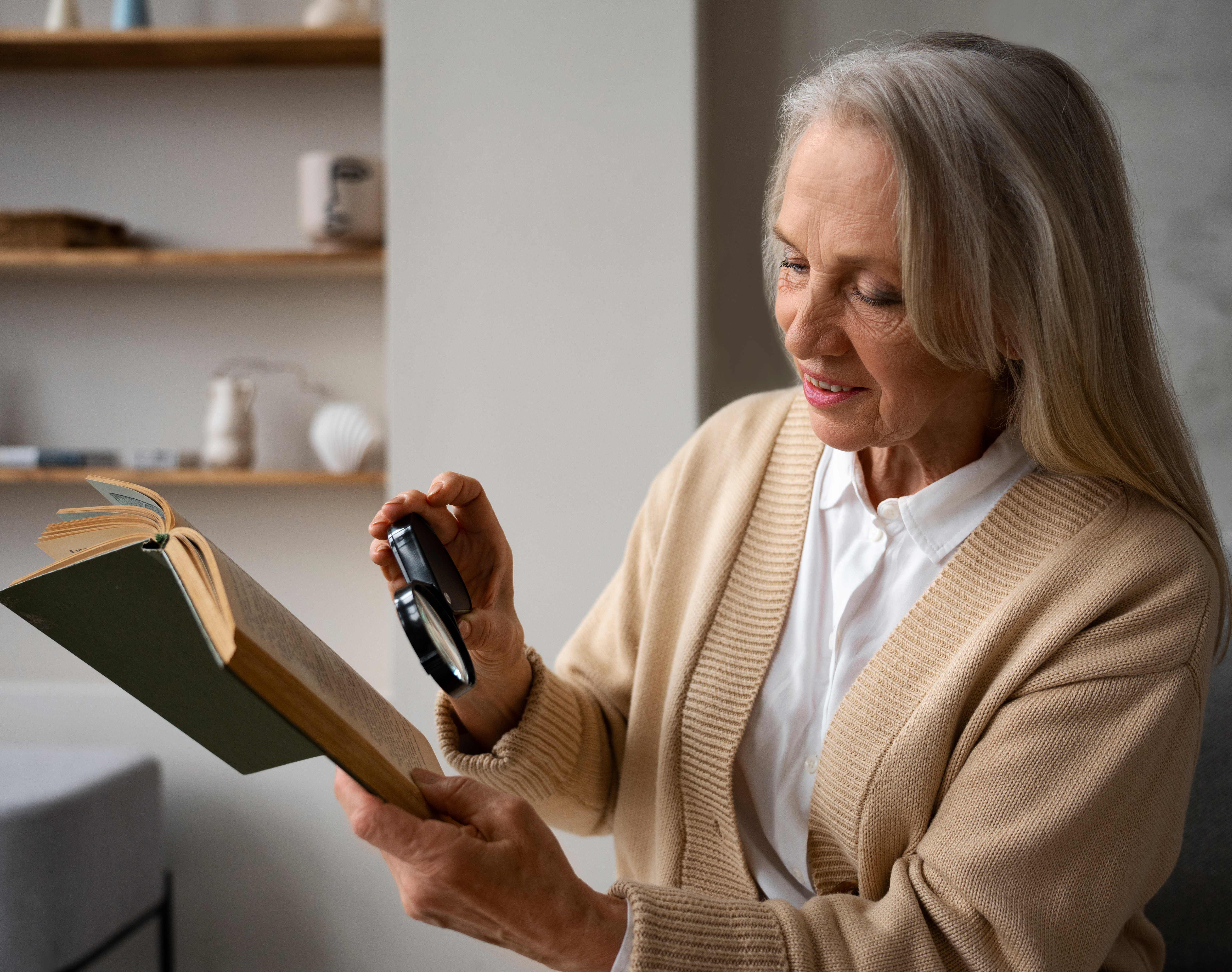 older-woman-using-magnifying-glass-read-2